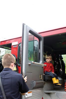 Second Annual Kid’s Equipment Day
Little kids and big, big machines on a warm spring Marion morning made for tons of fun at the Marion Recreation’s Second Annual Kid’s Equipment Day on May 10. A row of different Town-owned vehicles including a police cruiser, ambulance, earth diggers, a fire engine, and fire trucks lined the Town House field. There were plenty of Department of Public Works, police, and fire personnel on hand to demonstrate how the vehicles work, to turn on lights and alarms, and answer questions. Photo by Jean Perry
