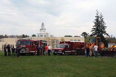 Second Annual Kid’s Equipment Day
Little kids and big, big machines on a warm spring Marion morning made for tons of fun at the Marion Recreation’s Second Annual Kid’s Equipment Day on May 10. A row of different Town-owned vehicles including a police cruiser, ambulance, earth diggers, a fire engine, and fire trucks lined the Town House field. There were plenty of Department of Public Works, police, and fire personnel on hand to demonstrate how the vehicles work, to turn on lights and alarms, and answer questions. Photo by Jean Perry
