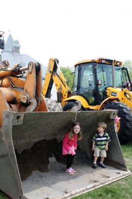 Second Annual Kid’s Equipment Day
Little kids and big, big machines on a warm spring Marion morning made for tons of fun at the Marion Recreation’s Second Annual Kid’s Equipment Day on May 10. A row of different Town-owned vehicles including a police cruiser, ambulance, earth diggers, a fire engine, and fire trucks lined the Town House field. There were plenty of Department of Public Works, police, and fire personnel on hand to demonstrate how the vehicles work, to turn on lights and alarms, and answer questions. Photo by Jean Perry
