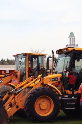 Second Annual Kid’s Equipment Day
Little kids and big, big machines on a warm spring Marion morning made for tons of fun at the Marion Recreation’s Second Annual Kid’s Equipment Day on May 10. A row of different Town-owned vehicles including a police cruiser, ambulance, earth diggers, a fire engine, and fire trucks lined the Town House field. There were plenty of Department of Public Works, police, and fire personnel on hand to demonstrate how the vehicles work, to turn on lights and alarms, and answer questions. Photo by Jean Perry
