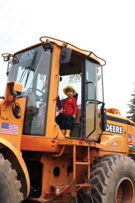 Second Annual Kid’s Equipment Day
Little kids and big, big machines on a warm spring Marion morning made for tons of fun at the Marion Recreation’s Second Annual Kid’s Equipment Day on May 10. A row of different Town-owned vehicles including a police cruiser, ambulance, earth diggers, a fire engine, and fire trucks lined the Town House field. There were plenty of Department of Public Works, police, and fire personnel on hand to demonstrate how the vehicles work, to turn on lights and alarms, and answer questions. Photo by Jean Perry
