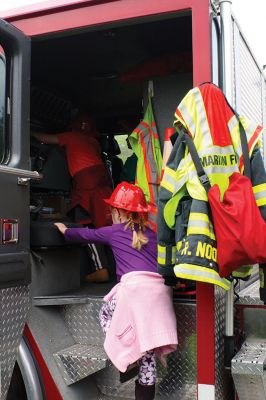 Second Annual Kid’s Equipment Day
Little kids and big, big machines on a warm spring Marion morning made for tons of fun at the Marion Recreation’s Second Annual Kid’s Equipment Day on May 10. A row of different Town-owned vehicles including a police cruiser, ambulance, earth diggers, a fire engine, and fire trucks lined the Town House field. There were plenty of Department of Public Works, police, and fire personnel on hand to demonstrate how the vehicles work, to turn on lights and alarms, and answer questions. Photo by Jean Perry
