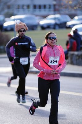 Marion Turkey Trot
It was a cold start, race, and finish for the Marion Recreation Annual Turkey trot this Sunday but spirits were high. Matt Sylvain of Dartmouth took top honors for the men with a time of 18:33 and Allison Rossi for the Women with a time of 21:02. Photos by Felix Perez
