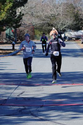 Marion Turkey Trot
It was a cold start, race, and finish for the Marion Recreation Annual Turkey trot this Sunday but spirits were high. Matt Sylvain of Dartmouth took top honors for the men with a time of 18:33 and Allison Rossi for the Women with a time of 21:02. Photos by Felix Perez
