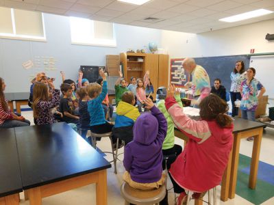 Tie Dye Fun
Students at the Marion Natural History After School Program learned about chemical reactions and colors during a tie-dye shirt-making session held this past week with UMass Dartmouth Chemistry Professor Tobey Dills. Photo courtesy of Elizabeth Leidhold
