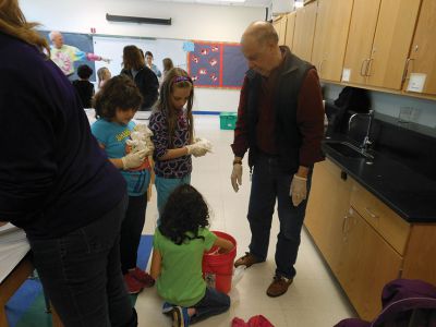 Tie Dye Fun
Students at the Marion Natural History After School Program learned about chemical reactions and colors during a tie-dye shirt-making session held this past week with UMass Dartmouth Chemistry Professor Tobey Dills. Photo courtesy of Elizabeth Leidhold
