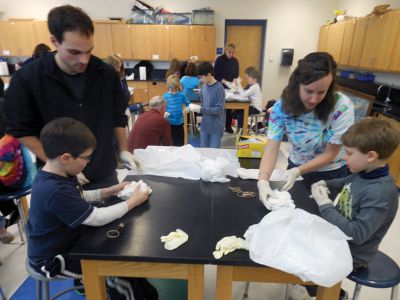 Tie Dye Fun
Students at the Marion Natural History After School Program learned about chemical reactions and colors during a tie-dye shirt-making session held this past week with UMass Dartmouth Chemistry Professor Tobey Dills. Photo courtesy of Elizabeth Leidhold
