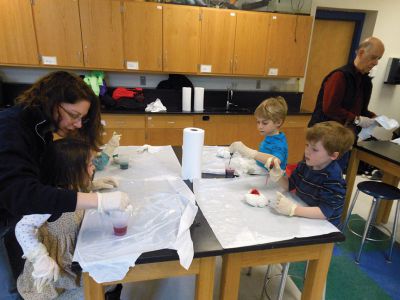 Tie Dye Fun
Students at the Marion Natural History After School Program learned about chemical reactions and colors during a tie-dye shirt-making session held this past week with UMass Dartmouth Chemistry Professor Tobey Dills. Photo courtesy of Elizabeth Leidhold
