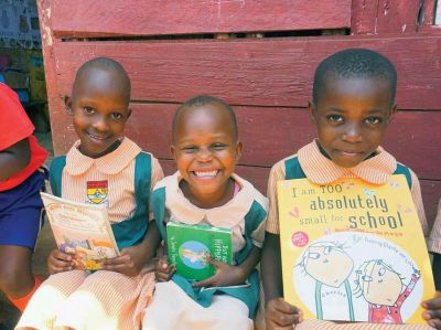 Kansanga Parents Primary School in Uganda
Students from the Kansanga Parents Primary School in Uganda hold donated books they received from students of Old Hammondtown School. The idea of providing a book for each of the 270 students was conceived by Ari Uhlin and her son Kai, with the help of Ari’s friend, Megan McMurrin, who lives in Uganda. Photos courtesy Megan McMurrin
