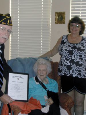 Mary Clare Doyle
 100-year-old Mary Clare Doyle was recognized for her 68-year membership to the Florence Eastman Post 280 in Mattapoisett.  Doyle was recognized by Post 280 Chaplain Richard Langhoff, left, and his wife Ilona, right.  Doyle, center, turned 100 on August 16.  She was formerly a resident of Mattapoisett and currently resides in Meredith, NY.  Photo courtesy of Richard Langhoff. 
