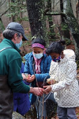 Vernal Pools
Eleven-year-olds Ava Duponte (center), and Jonalisa Vieira (right), of Mattapoisett, handle what are believed to be salamander and wood frog egg masses. The children participated in an April 17 exploration of a vernal pool led by Mattapoisett Land Trust Treasurer and wildlife expert Gary Johnson (left). The exploration led a party of 10 along a muddy trail through the woods off Angelica Avenue past a forest clearing and ultimately to two vernal pools. Photo by Mick Colageo April 22, 2021
