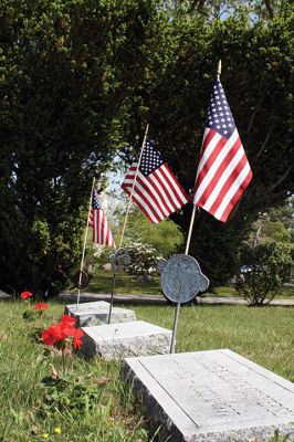 Memorial Day
Town volunteers, as well as the local Boy Scouts and Girl Scouts, have prepared the Evergreen Cemetery for Memorial Day, with flower plantings and the placement of flags on the graves of our veterans. See the article “Tri-Town Remembers…” for a summary of the Memorial Day observances in your community. Photo by Jean Perry. May 25, 2017 edition
