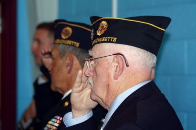 Veteran’s Day 
On November 12, members of the Mattapoisett community gathered together at Old Hammondtown Elementary School for their annual Veteran’s Day ceremony.  Commander Michael Lamoureux served as emcee of the event while State Representative William Straus, Selectman Paul Silva, Veterans’ Agent Barry Denham and U.S. Navy Lieutenant Scott Burrill addressed the audience.  The school’s chorus and band played patriotic tunes while the Mattapoisett Police Department presented the colors.  Photos by Katy Fitzpatrick
