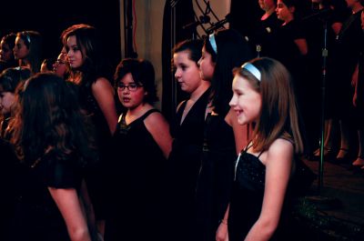 Voices in Time
Voices in Time, a choir of children led by Sharon Jensen, held a concert at the Knights of Columbus hall in Mattapoisett on December 27. Members performed jazz and swing standards in front of a packed house with special guest Mark Mahar, who is the founder and bandleader for Boston Swing. Photo by Felix Perez.
