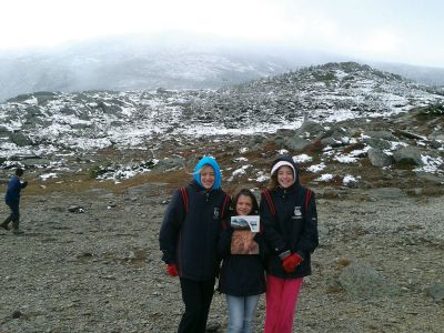 Mount Washington
On Saturday, October 6, Isabelle Choquette, left, April Choquette, middle, and Gabrielle Choequette, right, attempted to drive to the top of Mount Washington in New Hampshire.  Unfortunately, due to snow and visibility issues, they had to stop their journey at the 4-mile mark.  Still, they took out their copy of The Wanderer for a picture!  Photo by Teresa Choquette.
