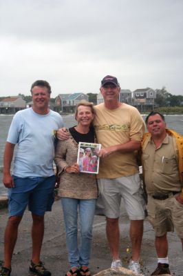 Hurricane Irene
These hardy Wandering Wanderers were out with their hometown paper... even in the middle of a tropical storm! On August 28, these folks watched Irene make landfall near their homes at Angelica Point. From left to right: Sean Leary, Mary Kelly, John Clifford, and Ronnie Sylvia. Photo by Anne Kakley.
