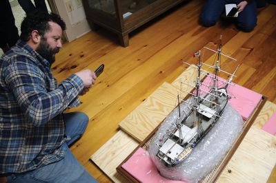 Whale Bark Wanderer
Mattapoisett Museum Curator Connor Gaudet and volunteer Bob Clifford unpack the custom model of the Whale Bark Wanderer 1878 recreated by artist George Lowery from scratch and donated to the museum. The model arrived on Tuesday afternoon from Arizona in a crate weighing a total of 181 pounds. The model joins two other models of the famous whaling ship in the museum, including a model built and donated by John D. Young. Photos by Mick Colageo
