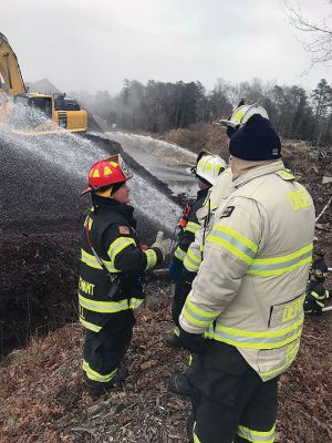 Tri-Town firefighters
The holidays were challenging for Tri-Town firefighters. Marion and Rochester fire departments were among towns assisting Wareham after a mulch pile in a remote location off County Road caught fire on Christmas Eve. Firefighters worked in cold temperatures for eight hours, dispensing approximately 200,000 gallons of water to extinguish the fire. Seen supporting Wareham Fire Chief John Kelley and 29 Wareham Fire personnel at the scene were Marion Fire Tanker 1, Lieutenant Michael Still and Captain Joel Watte
