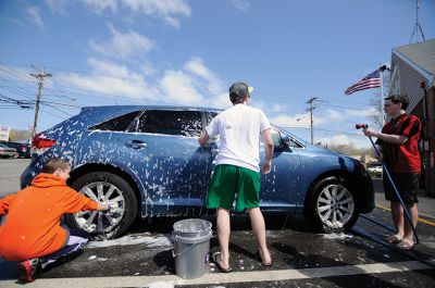 G.E.E.K. Carwash
Members of Old Rochester Regional Junior High School’s G.E.E.K. (Great Educated Entertaining Kids) team hosted a car wash at the Mattapoisett Fire House to raise funds for their trip to the Destination Imagination Global Finals in Knoxville, Tenn. Photo by Felix Perez.
