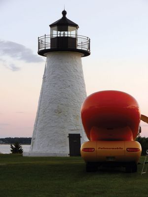 Wienermobile at Ned's Point
Those enjoying the afternoon at Ned’s Point Lighthouse on Sunday, August 17 did a double take when they suddenly saw a sight they were not expecting to see — a giant wiener on wheels parked alongside the Ned’s Point lighthouse. It was not just any wiener on wheels — it was the famous Oscar Mayer Wienermobile, on location taking some promotional photographs from Mattapoisett’s most iconic setting. Photo by Denise Mello
