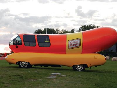 Wienermobile at Ned's Point
Those enjoying the afternoon at Ned’s Point Lighthouse on Sunday, August 17 did a double take when they suddenly saw a sight they were not expecting to see — a giant wiener on wheels parked alongside the Ned’s Point lighthouse. It was not just any wiener on wheels — it was the famous Oscar Mayer Wienermobile, on location taking some promotional photographs from Mattapoisett’s most iconic setting. Photo by Denise Mello
