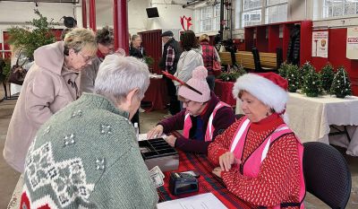 Mattapoisett Woman's Club
Inclement weather forced the Mattapoisett Woman's Club to move its Holidays Wreath and Greens Sale indoors, and the club was thrilled that the December 3 event, with the assistance of MWC members Cindy Turse and Sandy Hering, Fire Chief Andy Murray and Town Administrator Mike Lorenco, was able to go on as scheduled in the Old Firehouse on Route 6. Wreaths sold out within the first hour of the sale, with swags, table pieces, box designs and special ornaments, all exquisitely hand-decorated 
