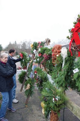 Christmas Wreath Sale 
Team “Sole Survivor” held its annual Christmas wreath sale last weekend beginning on Black Friday, and they will continue to sell hand-decorated wreaths and crafts throughout this weekend while supplies last. The group is stationed out front of 428 Wareham Road (Route 6) in Marion. All proceeds benefit the Tri-Town Relay for Life. Photos by Colin Veitch
