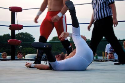 Rochester Wrestling
On Friday, August 17, 2012, the Rochester Country Fair played host to a wrestling match that featured many area performers.  While the hits may be fake, the falls are quite real.  Photo by Eric Tripoli.
