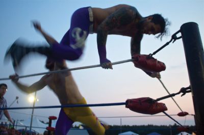 Rochester Wrestling
On Friday, August 17, 2012, the Rochester Country Fair played host to a wrestling match that featured many area performers.  While the hits may be fake, the falls are quite real.  Photo by Eric Tripoli.
