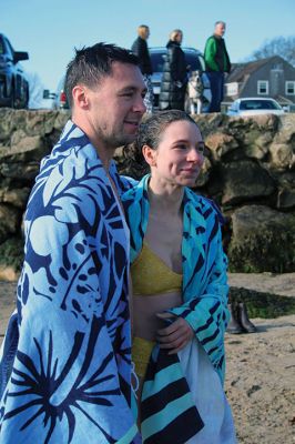 Christmas Day Plunge
At 94, Bob Humphrey was the elder statesman participating in the Christmas Day plunge held at Mattapoisett Town Beach, which including 47 swimmers and raised $2,595 in donations for the benefit of Helping Hands & Hooves. While December 25 was unseasonably mild, the water temperature in the harbor was still chilly as the effort inspired camaraderie among participating friends and couples. Photos by Mick Colageo
