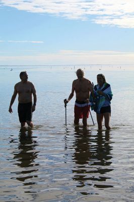 Christmas Day Plunge
At 94, Bob Humphrey was the elder statesman participating in the Christmas Day plunge held at Mattapoisett Town Beach, which including 47 swimmers and raised $2,595 in donations for the benefit of Helping Hands & Hooves. While December 25 was unseasonably mild, the water temperature in the harbor was still chilly as the effort inspired camaraderie among participating friends and couples. Photos by Mick Colageo
