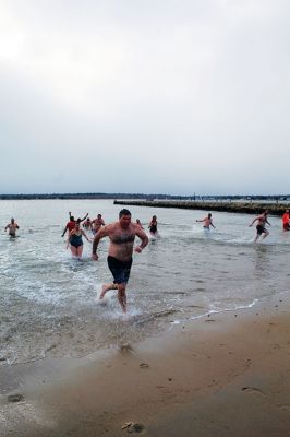 Christmas Plunge
An ice-cold Christmas morning in Mattapoisett did not stop citizens from jumping all the way into the waters of Mattapoisett Town Beach in support of Helping Hands and Hooves. Photos by Mick Colageo
