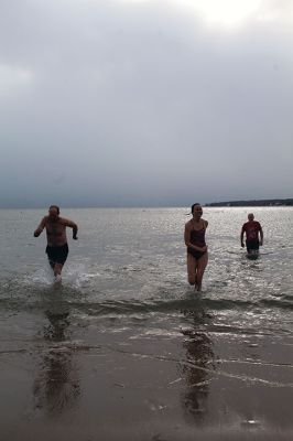 Christmas Plunge
An ice-cold Christmas morning in Mattapoisett did not stop citizens from jumping all the way into the waters of Mattapoisett Town Beach in support of Helping Hands and Hooves. Photos by Mick Colageo
