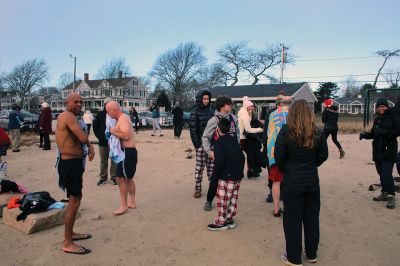 Christmas Plunge
An ice-cold Christmas morning in Mattapoisett did not stop citizens from jumping all the way into the waters of Mattapoisett Town Beach in support of Helping Hands and Hooves. Photos by Mick Colageo
