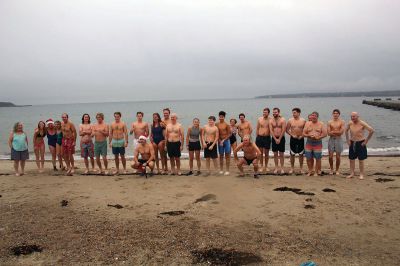 Christmas Swim
Kate Butler was last to arrive but last one out of the water after two dozen people braved the cold, raw elements of the 2021 Christmas morning swim held December 25 at Mattapoisett Town Beach. The event was held for the benefit of Helping Hands and Hooves, a program run by Julie Craig and Debbie Dyson that offers experiences, especially horseback riding, to people with cognitive challenges who have aged out of the many children's programs. Photos by Mick Colageo
