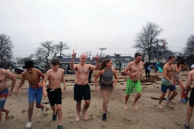 Christmas Swim
Kate Butler was last to arrive but last one out of the water after two dozen people braved the cold, raw elements of the 2021 Christmas morning swim held December 25 at Mattapoisett Town Beach. The event was held for the benefit of Helping Hands and Hooves, a program run by Julie Craig and Debbie Dyson that offers experiences, especially horseback riding, to people with cognitive challenges who have aged out of the many children's programs. Photos by Mick Colageo
