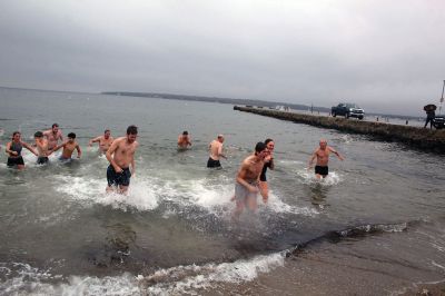 Christmas Swim
Kate Butler was last to arrive but last one out of the water after two dozen people braved the cold, raw elements of the 2021 Christmas morning swim held December 25 at Mattapoisett Town Beach. The event was held for the benefit of Helping Hands and Hooves, a program run by Julie Craig and Debbie Dyson that offers experiences, especially horseback riding, to people with cognitive challenges who have aged out of the many children's programs. Photos by Mick Colageo
