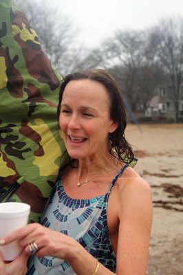 Christmas Swim
Kate Butler was last to arrive but last one out of the water after two dozen people braved the cold, raw elements of the 2021 Christmas morning swim held December 25 at Mattapoisett Town Beach. The event was held for the benefit of Helping Hands and Hooves, a program run by Julie Craig and Debbie Dyson that offers experiences, especially horseback riding, to people with cognitive challenges who have aged out of the many children's programs. Photos by Mick Colageo
