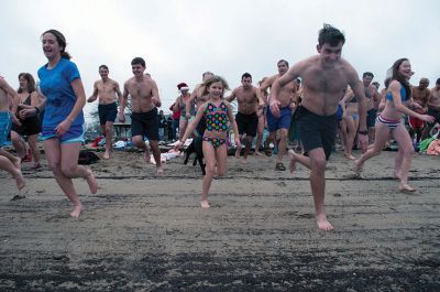 Christmas Day Swim
On Tuesday, December 25, many Tri-Town residents braved the chilly temperatures and jump into Mattapoisett Town Beach for the 12th Annual Christmas Day Swim.  All of the proceeds benefitted the Helping Hands and Hooves organization, which provides therapeutic horseback rides to people with disabilities.  Photo by Felix Perez. 
