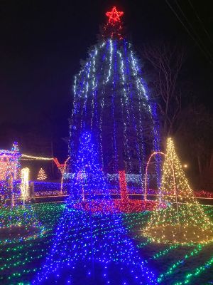 Christmas Lights
Marino Carrerio of Mattapoisett held the lighting of his home’s Christmas décor Saturday, November 30. Pictured is a lit walkway leading to the side of the property and to more lights and decorations. Photo by Shawn Sweet. 

