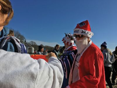 Christmas Day Swim
The 16th Annual Christmas Day Swim for Helping Hands and Hooves took place under bright blue cloudless skies and a balmy 43 degrees as dozens of families and friends took the plunge at Mattapoisett Town Beach. Photos by Marilou Newell
