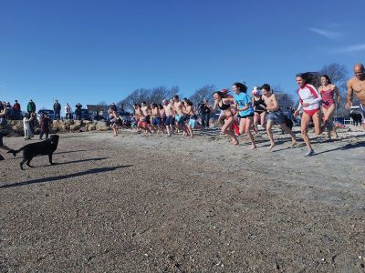 Christmas Day Swim
The 16th Annual Christmas Day Swim for Helping Hands and Hooves took place under bright blue cloudless skies and a balmy 43 degrees as dozens of families and friends took the plunge at Mattapoisett Town Beach. Photos by Marilou Newell
