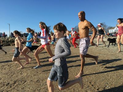 Christmas Day Swim
The 16th Annual Christmas Day Swim for Helping Hands and Hooves took place under bright blue cloudless skies and a balmy 43 degrees as dozens of families and friends took the plunge at Mattapoisett Town Beach. Photos by Marilou Newell
