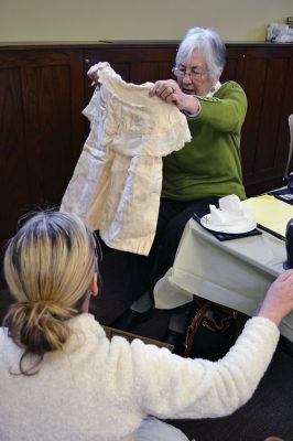 Library Treasures
Word spread of the Antiques Roadshow-style fundraiser at the Mattapoisett Library on March 29, attracting scores of South Coasters clutching their treasures, antiques, and heirlooms for appraisal and admiration, hoping Francis McNamee of the Marion Antique Shop might discover worth in their belongings beyond their sentimental value. Paying $5 per item appraised, some brought primitive dolls, old books, tea sets, and artwork. By Jean Perry
