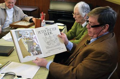 Library Treasures
Word spread of the Antiques Roadshow-style fundraiser at the Mattapoisett Library on March 29, attracting scores of South Coasters clutching their treasures, antiques, and heirlooms for appraisal and admiration, hoping Francis McNamee of the Marion Antique Shop might discover worth in their belongings beyond their sentimental value. Paying $5 per item appraised, some brought primitive dolls, old books, tea sets, and artwork. By Jean Perry
