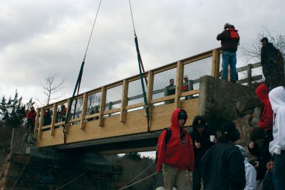 Bike Bridge
Beams with guardrails  built by students from Old Colony Regional Vocational Technical School  were hoisted into place on December 3, 2011, to widen a bridge over Mattapoisett River. The new 14-foot bridge, slated for completion in the spring of 2011, is part of the bike and pedestrian path. Photos by Laura Pedulli.
