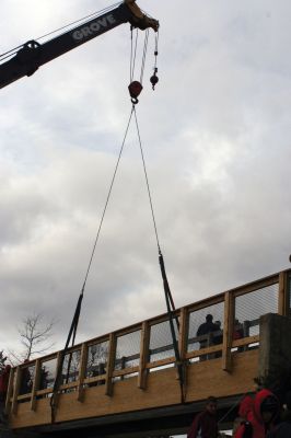 Bike Bridge
Beams with guardrails  built by students from Old Colony Regional Vocational Technical School  were hoisted into place on December 3, 2011, to widen a bridge over Mattapoisett River. The new 14-foot bridge, slated for completion in the spring of 2011, is part of the bike and pedestrian path. Photos by Laura Pedulli.
