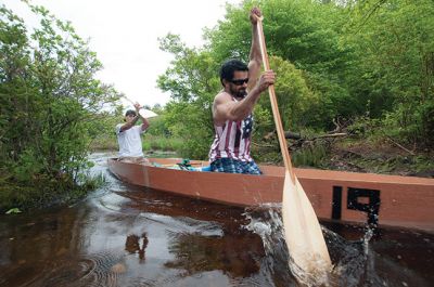 Memorial Day Boat Race
Keeping with an 80 year-old tradition, people with their home made boats raced toward the finish line during the annual Rochester Memorial Day Boat Race. Beginning at Grandma Hartley’s Reservoir on Snipatuit Road, boaters paddled the almost 12-mile race route to Herring Weir at River Road in Mattapoisett. There were 65 teams in all. Photo by Felix Perez.
