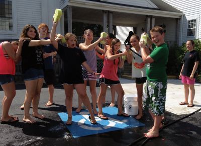 SCC Car Wash
The SouthCoast Children’s Chorus – along with parents and patrons – scrubbed for bucks during a car wash at the Mattapoisett Fire Station on Saturday afternoon, raising money for their general fund with a busy performance schedule coming up. “We hold fundraisers to support the work, the growth, and the performances of the Chorus,” Artistic Director Leslie Piper said. “We want every child to be able to sing, so we offer tuition scholarships for those who need them.” Photo by Shawn Badgley.
