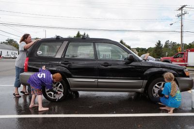 SCC Car Wash
The SouthCoast Children’s Chorus – along with parents and patrons – scrubbed for bucks during a car wash at the Mattapoisett Fire Station on Saturday afternoon, raising money for their general fund with a busy performance schedule coming up. “We hold fundraisers to support the work, the growth, and the performances of the Chorus,” Artistic Director Leslie Piper said. “We want every child to be able to sing, so we offer tuition scholarships for those who need them.” Photo by Shawn Badgley.
